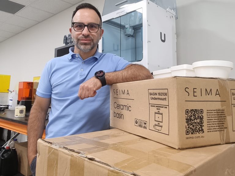Michael Segredos standing with a Seima box.